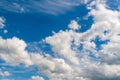 A variety of white clouds of unusual shapes and blue sky at noon