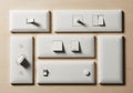 A variety of white plastic light switch plates arranged on a Royalty Free Stock Photo