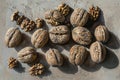 Variety of whole and cracked walnuts arranged artistically on a table, An artistic arrangement of whole and cracked walnuts Royalty Free Stock Photo