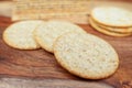 Assorted Whole Grain and Herb Crackers on a Wooden Cutting Board Royalty Free Stock Photo