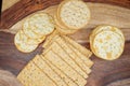 Assorted Whole Grain and Herb Crackers on a Wooden Cutting Board Royalty Free Stock Photo