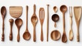 A variety of wooden kitchen utensils neatly displayed on a white background Royalty Free Stock Photo