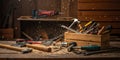 Variety of woodworking tools scattered across a workbench in a rustic workshop setting Royalty Free Stock Photo