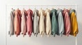 a variety of youth cashmere sweaters, hoodies, and sweatshirts arranged neatly on a clothes rack, suitable for mock-up