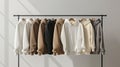 a variety of youth cashmere sweaters, hoodies, and sweatshirts arranged neatly on a clothes rack, suitable for mock-up
