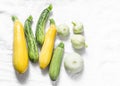 Variety zucchini, squash on a light background, top view. Vegetarian diet food concept.