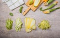 Variety Zucchini vegetable noodles - green zoodles or courgette spaghetti on plate over gray background. Clean eating, raw