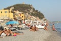 Varigotti, Italy, August 9 2017, crowded beach in an old fishermen village on the Italian coast at summer time