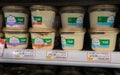 Varios of hummus boxes on shelf at Israeli food supermarket