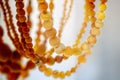 Various amber beads on a bright background