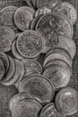 VARIOUS ANTIQUE BLACK AND WHITE COINS ON BLACK BACKGROUND Royalty Free Stock Photo