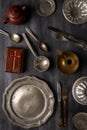 Various antique vintage dishes on black background