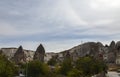 Various apartment houses and cave hotels on the street at the town Goreme in the center of Cappadocia Royalty Free Stock Photo