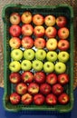Various apples in crates at farmers market Royalty Free Stock Photo