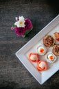 Asian canapes appetizer - Smoked salmon, maki, larb, tuna tartar Royalty Free Stock Photo