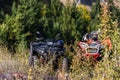 Various ATV quad motors in the forest area ready for adventurous driving