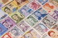 Collection of banknotes from different countries displayed on a table Royalty Free Stock Photo