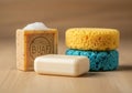 Various bathing items on a wooden surface. Includes a square bar of soap with visible Royalty Free Stock Photo