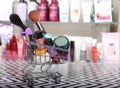 Various Beauty Products in shopping basket with blurred cosmetics Royalty Free Stock Photo