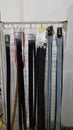 Various belts that are sold at the convenience store.