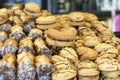 Various biscuits with condensed milk and poured chocolate on sale in a candy store