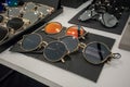 Various of black and gold sun glasses in the shop display shelves