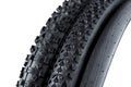 Various black rubber bicycle tyres with different type of tread profile isolated white background
