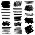 Various black scribbles and brush strokes on a white background for artistic design and illustration purposes Royalty Free Stock Photo