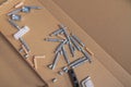 Various bolts, screws, wooden dowels, fasteners for assembling wooden furniture