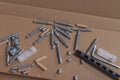 Various bolts, screws, wooden dowels, fasteners for assembling wooden furniture