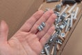 Various bolts, screws, wooden dowels, fasteners for assembling wooden furniture