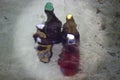 Various bottles cooled with water in a fountain.