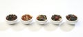 Various bowls of premium tea leaves blends