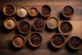 various bowls scattered on a wooden table full of roasted coffee seeds