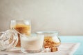 Various bowls with sugar on blue wooden table Royalty Free Stock Photo