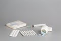 Various boxes of medication, blisters with pills, syringes and white bottles with medication Royalty Free Stock Photo