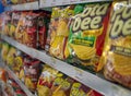 Various brand of snack, potato chip or junk food on the supermarket shelves