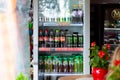 Various brands of beverages, rows of cold drinks in a fridge sold in a shop small convenience store Coca-cola, Monster, Fuzetea