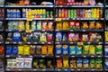 Various brands of local and imported potato chips and snacks on the shelf in a grocery store