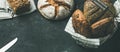 Various bread loaves on grey concrete background, copy space Royalty Free Stock Photo