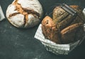 Various bread loaves over black background, copy space Royalty Free Stock Photo