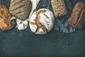 Various bread selection flat-lay, black background, copy space Royalty Free Stock Photo