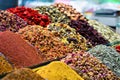 Various bright colored powder spices and fruit herbal tea and dried vegetables on market in Istanbul, Turkey Royalty Free Stock Photo