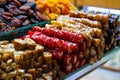 Various bright colored turkish delights sweets baklava lokum and dried fruits vegetables on market in Istanbul, Turkey Royalty Free Stock Photo