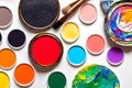 Various bright paints on white background. Palette with paints and brushers Royalty Free Stock Photo