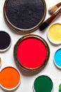 Various bright paints on white background. Palette with paints and brushers Royalty Free Stock Photo