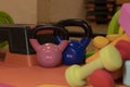 Various bright sports equipment. Kettlebells, fitness bands, cubes, rugs, dumbbells, barbell, step platform.