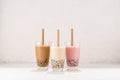 Various Bubble Tea in glasses with drink straws on white background Royalty Free Stock Photo