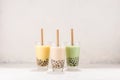 Various Bubble Tea in glasses with drink straws on white background Royalty Free Stock Photo