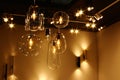 Various bulb shaped chandeliers, wall and ceiling mounted lights with warm LED light sources made by Nowodvorski lighting